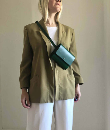 CARV green leather bum bag worn on model with green jacket