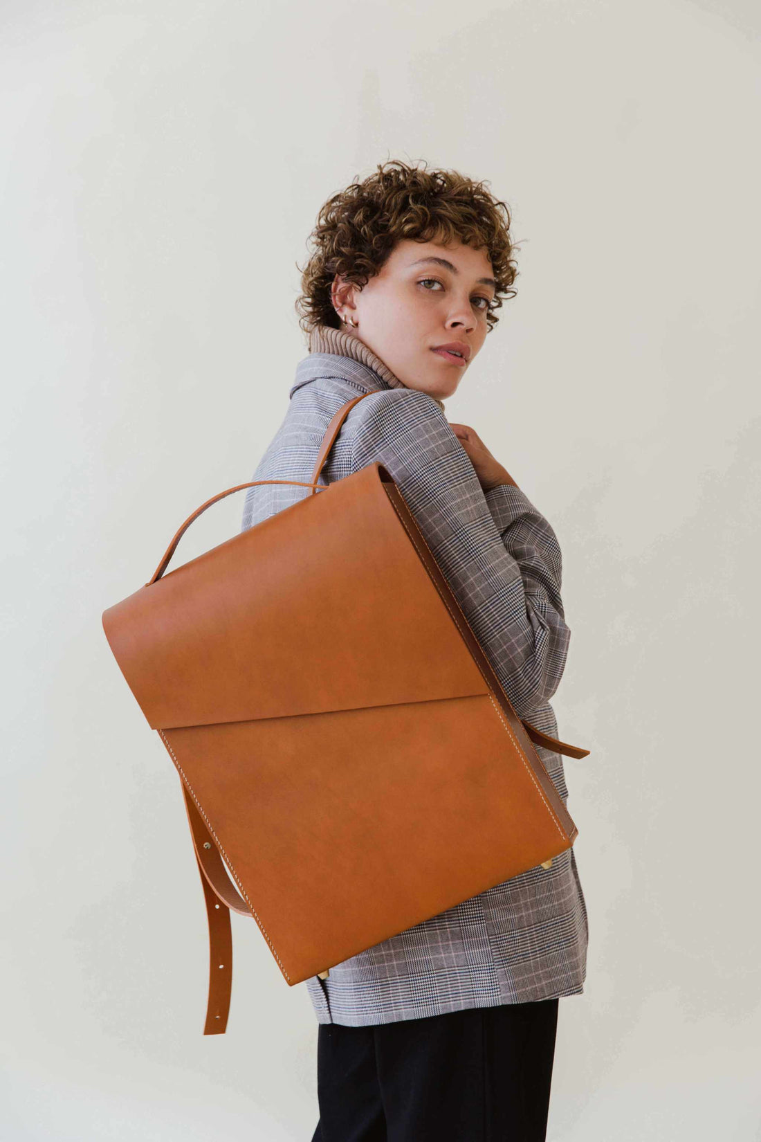 CARV handmade leather backpack in minimalist style with smooth matte tan leather