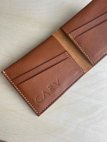 Handmade leather wallet in tan open billfold style