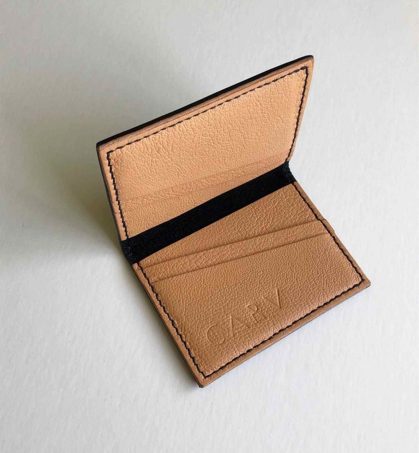 Hand Stitched Black Leather Bifold Card Wallet by CARV, featuring vegetable-tanned leather and minimalist design.