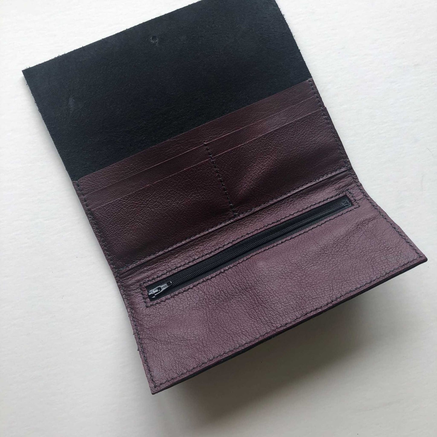 Nomad Maxi Leather Folding Wallet Purse open view, showing card slots and zip pocket in black or tan leather.