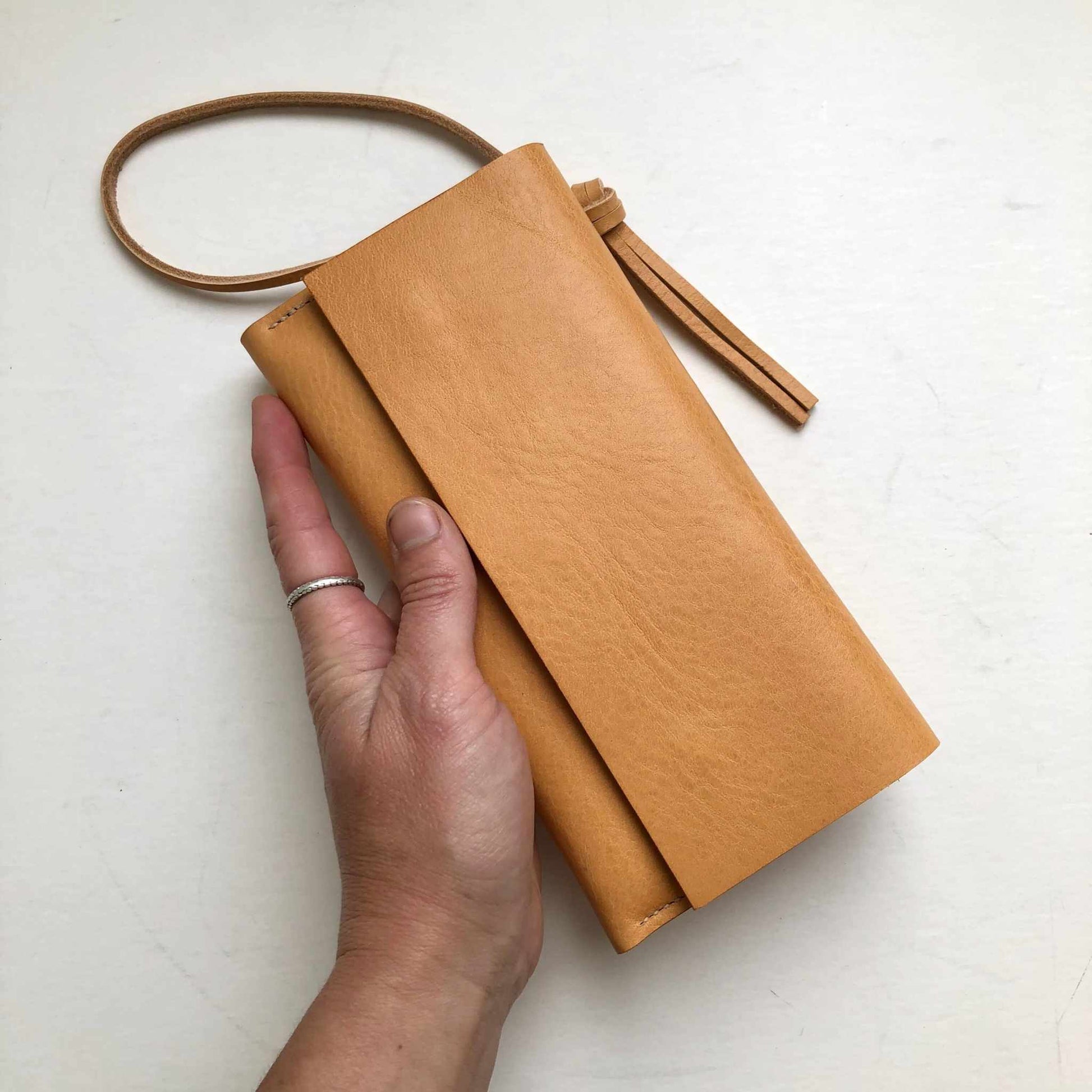 Knot Leather Purse Wallet in natural tan with knot wrist strap.