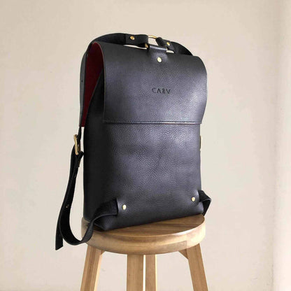 Nomad Black Leather Backpack made in England, minimalist design, high-quality leather, adjustable straps, customizable interior, versatile for urban use.