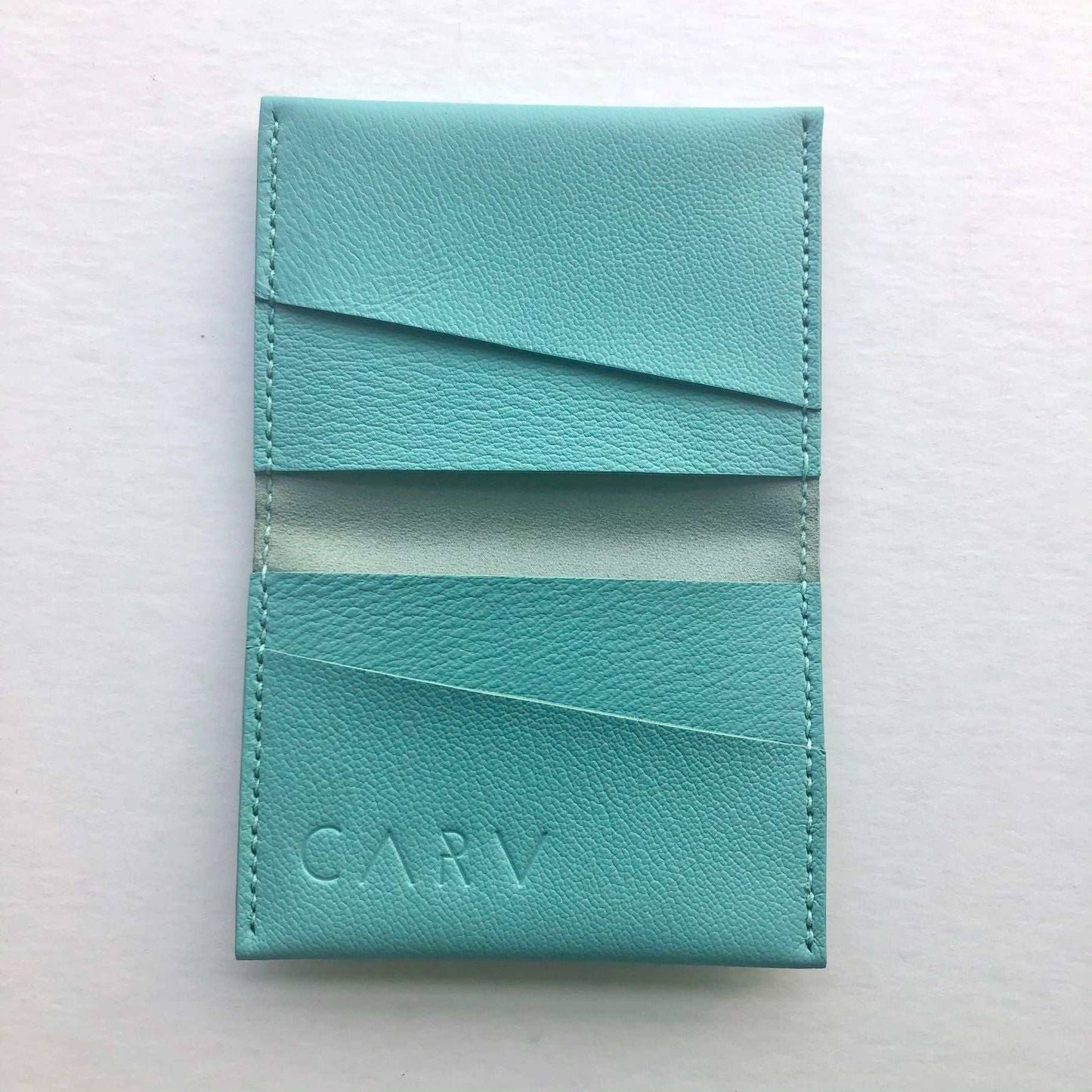 Fold Leather Bifold Card Wallet in Turquoise by CARV, sustainable and handcrafted with vegetable-tanned leather, minimalist and elegant design.