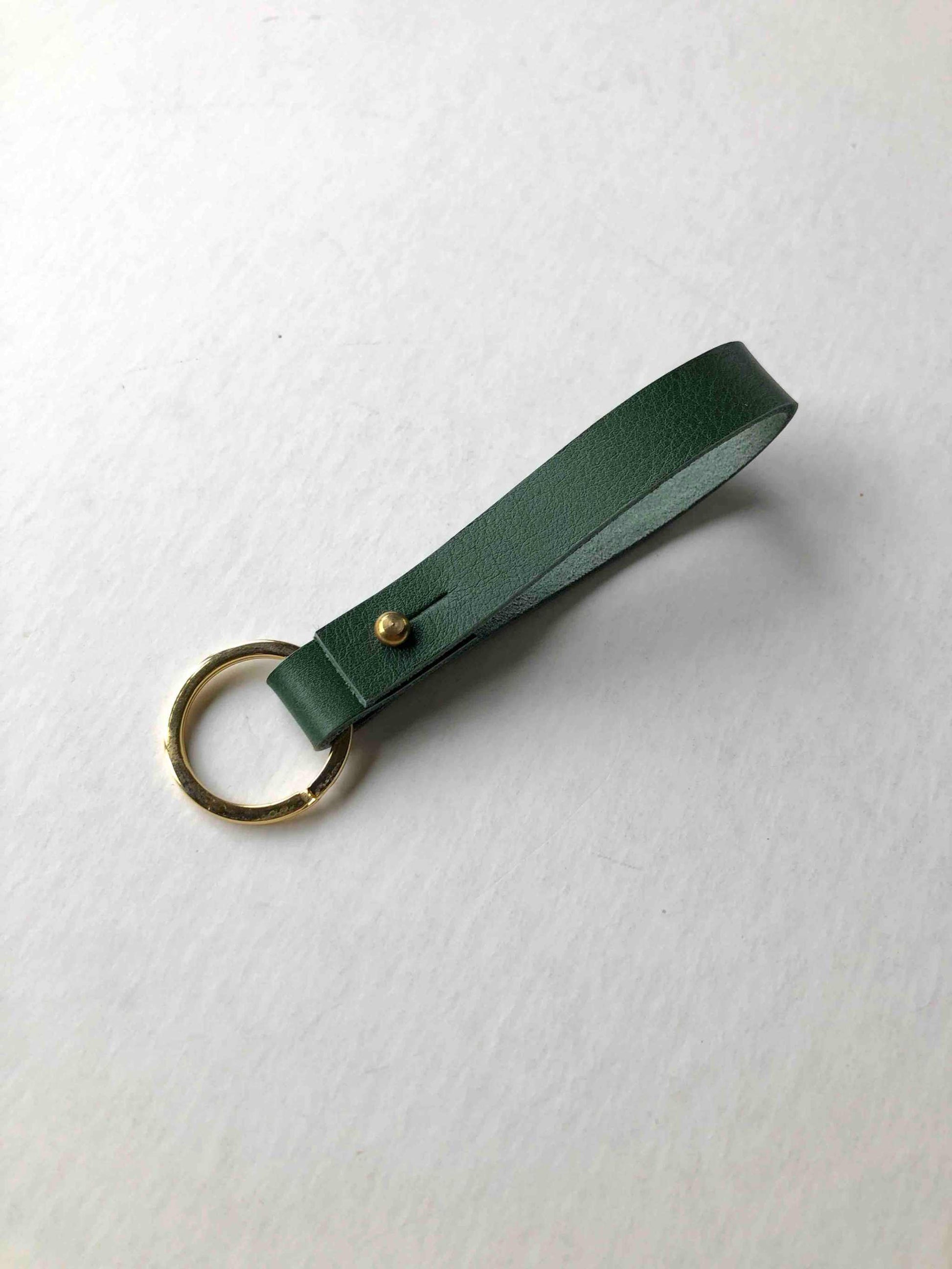 Forest green personalised leather keyring with brass closure.