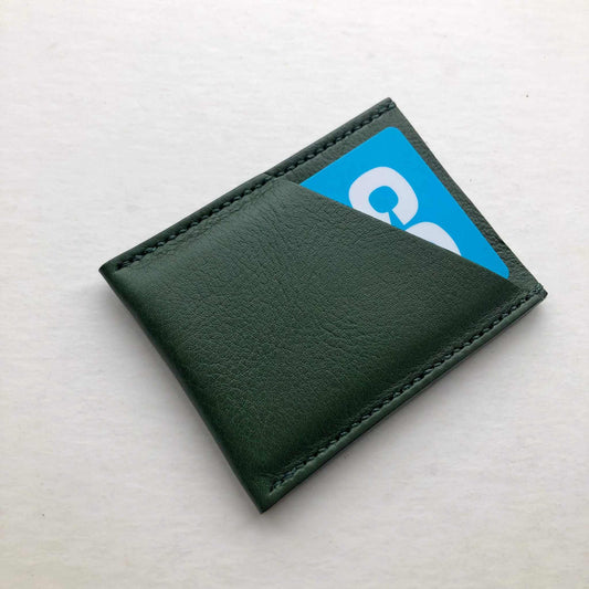 Green Leather Card Sleeve by CARV, minimalist design, fits four cards, sustainable craftsmanship.