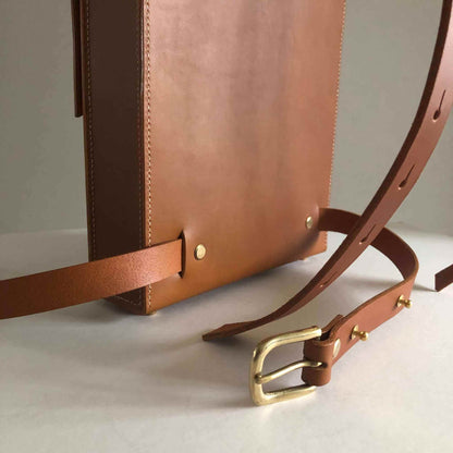 Tan Leather Backpack with adjustable straps and smooth matte finish.