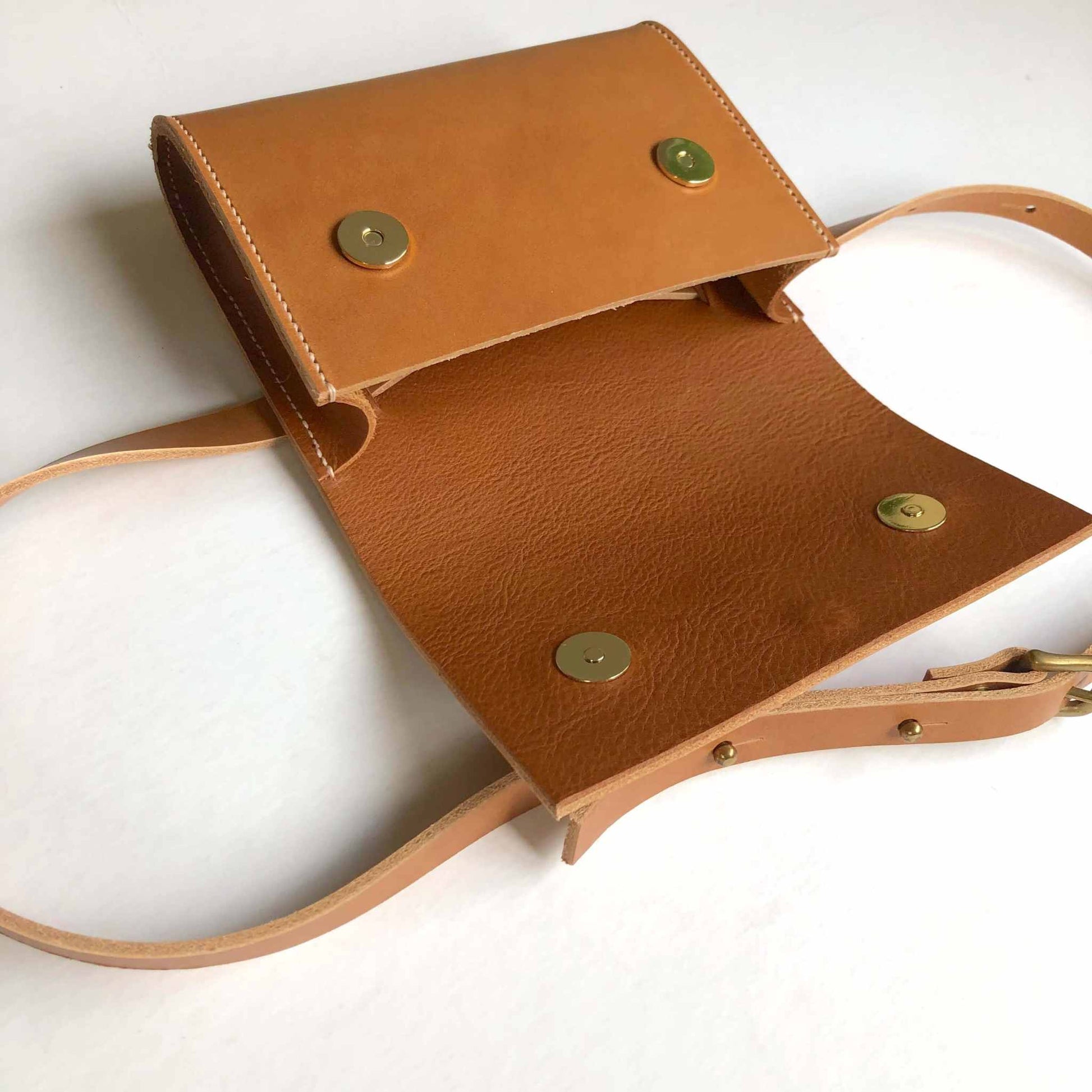 Tan Leather Belt Bag by CARV, handcrafted in the UK, adjustable strap, minimalist design, sustainable vegetable-tanned leather.