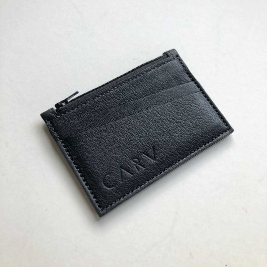 Black Zipped Leather Card Holder by CARV with minimalist design and stitched card slots.