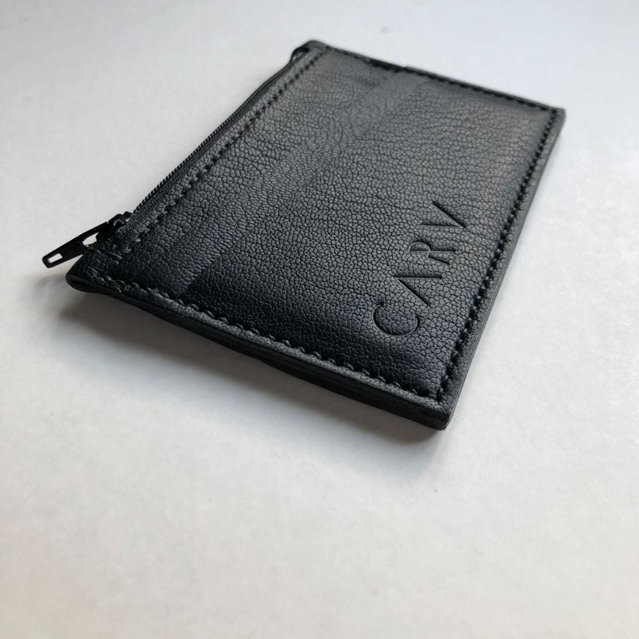 Black Zipped Leather Card Holder by CARV made from handcrafted vegetable-tanned leather with zipper pocket and three card slots.