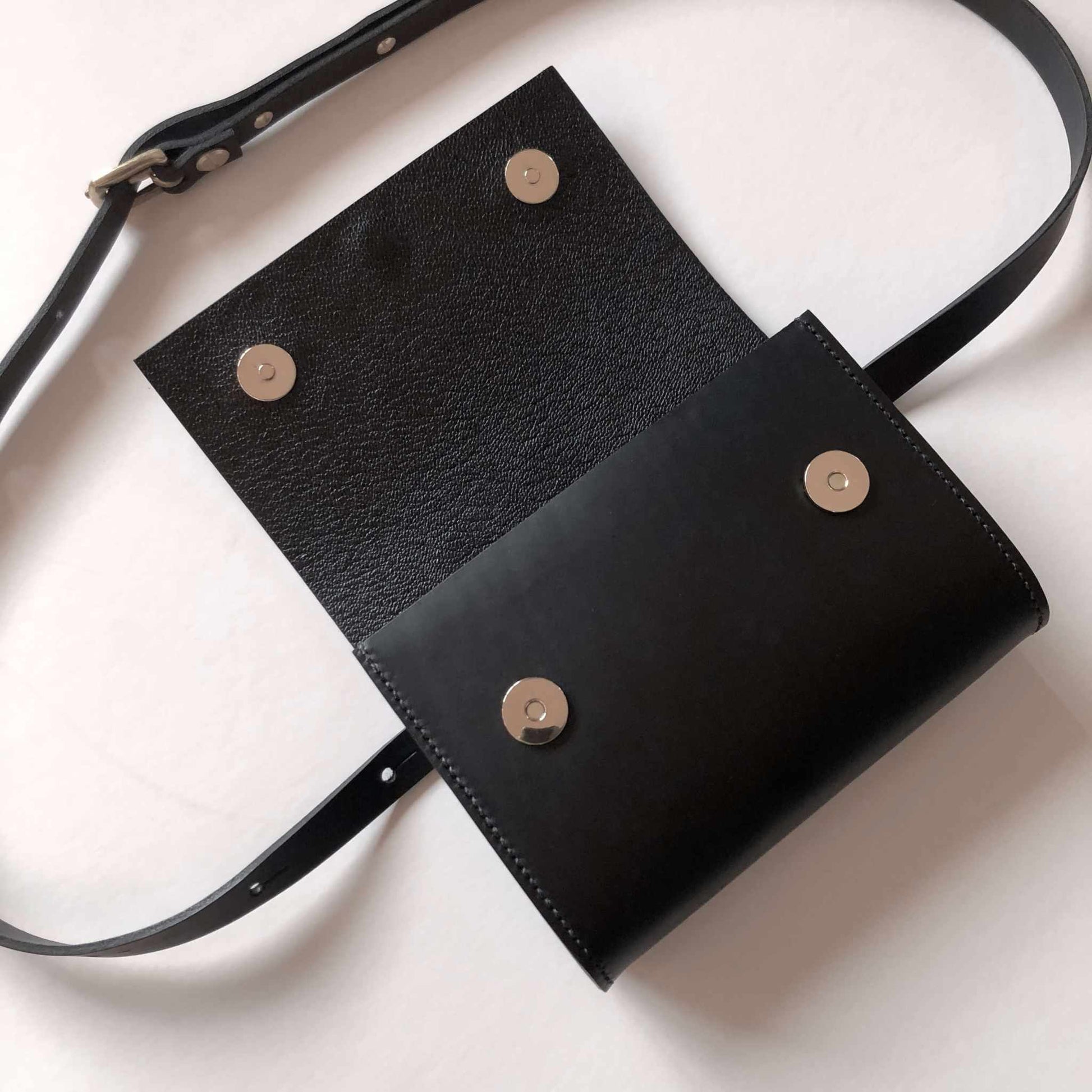 Sedna Black Leather Bum Bag with adjustable strap and magnetic clasps.