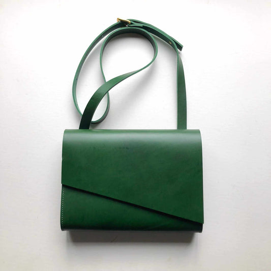 Pioneer Midi Green Leather Crossbody Bag with asymmetrical flap and adjustable strap.