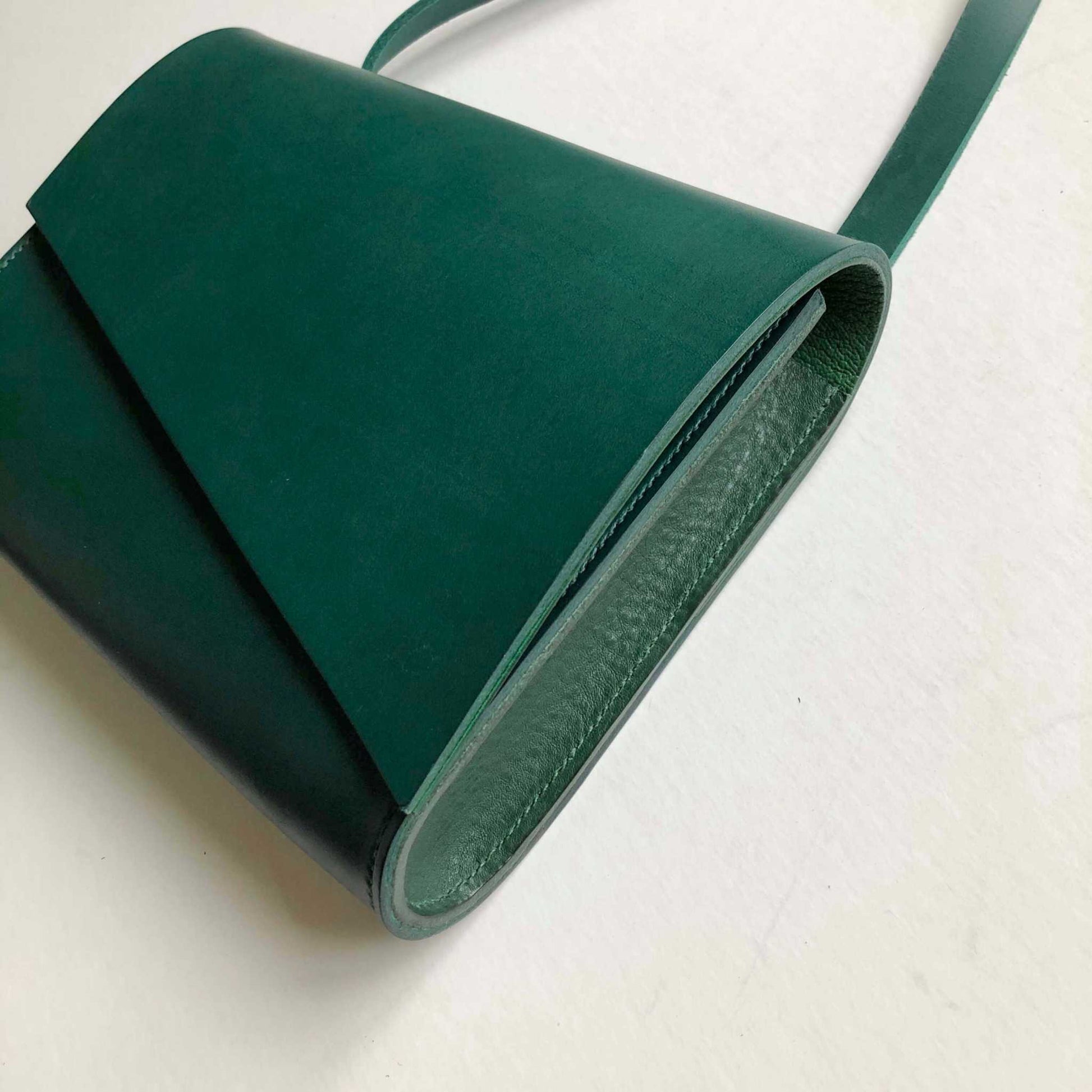 Pioneer Midi Green Leather Crossbody Bag with asymmetrical flap and adjustable strap.