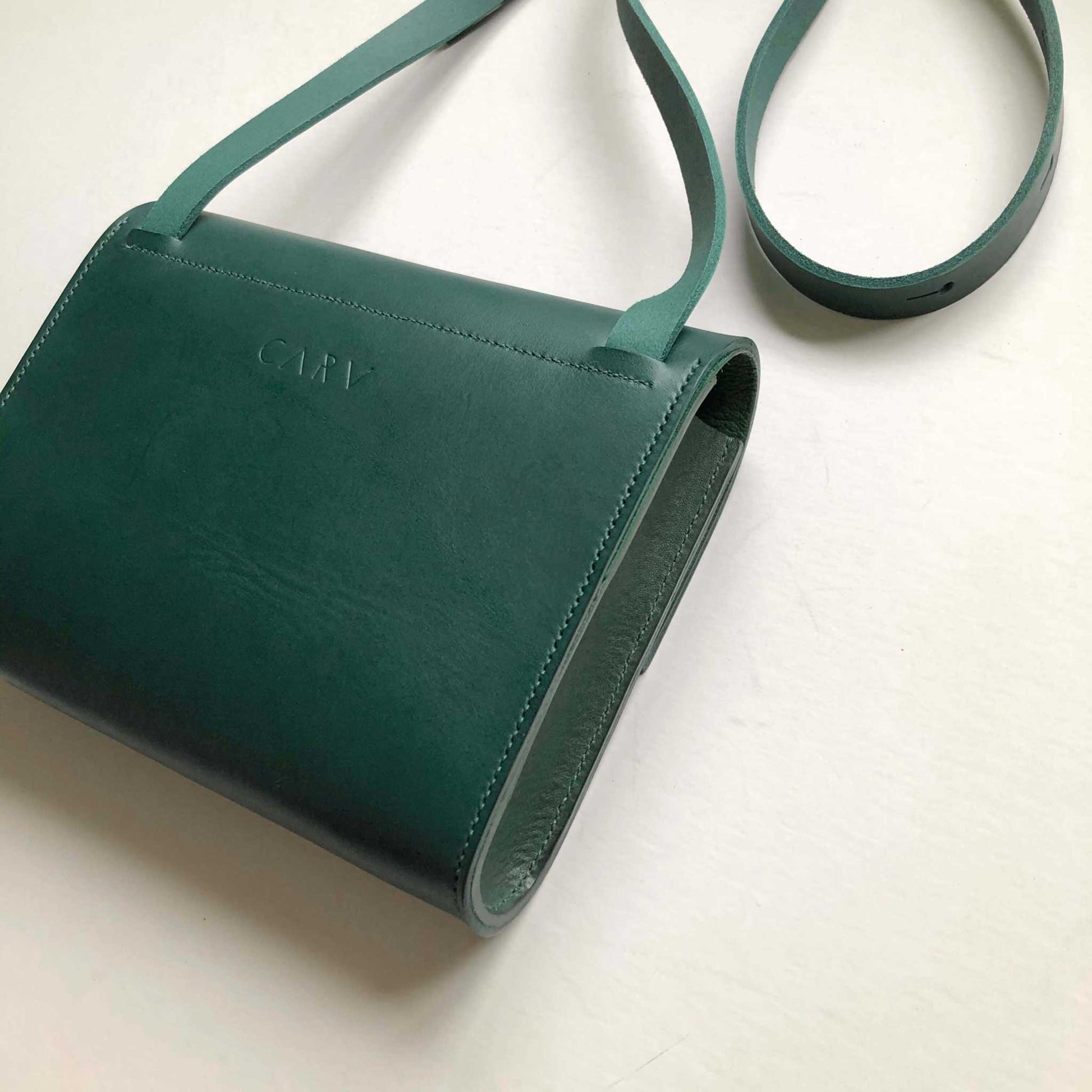 Pioneer Midi Green Leather Crossbody Bag by CARV, handcrafted in sustainable vegetable-tanned leather, featuring an adjustable strap and structured design.