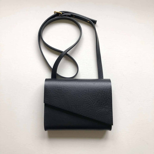 Pioneer Mini Black Leather Crossbody Bag with adjustable strap, made from sustainable vegetable-tanned leather.