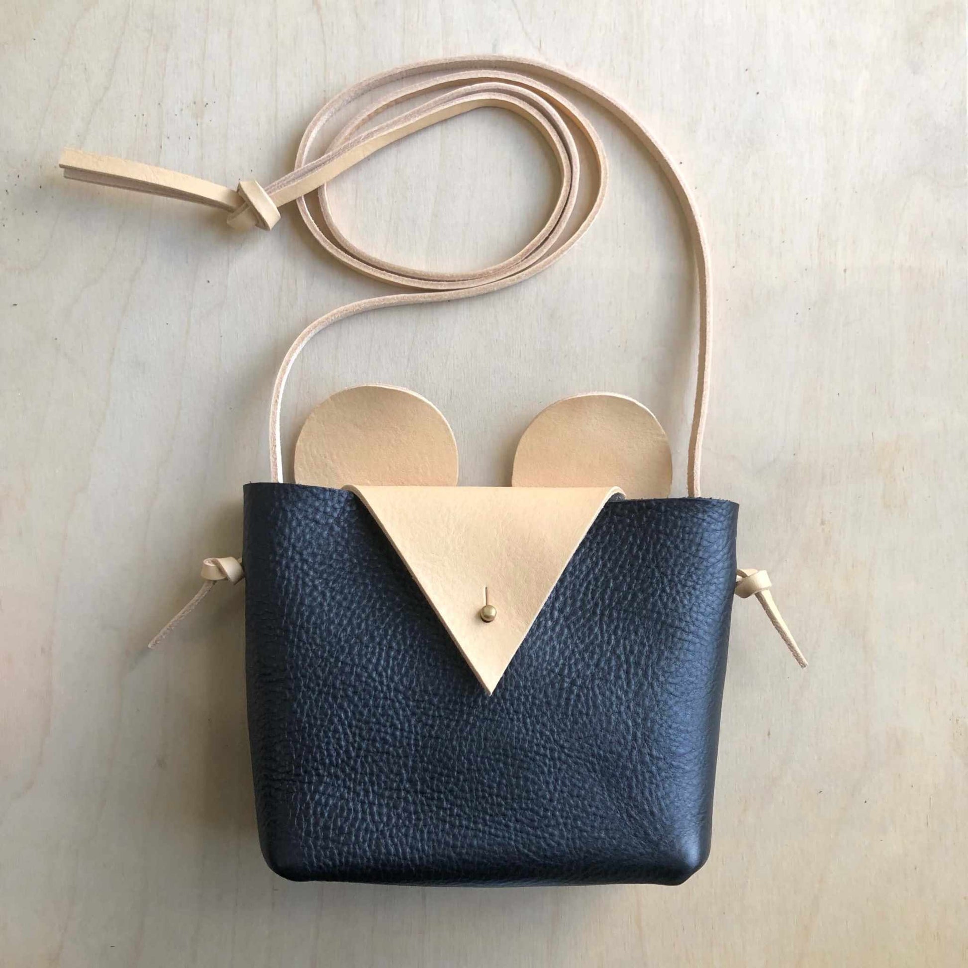 Charming Little Mouse Kids Crossbody Bag in black pebble leather with natural ears and nose, showcasing playful design and sustainable craftsmanship.