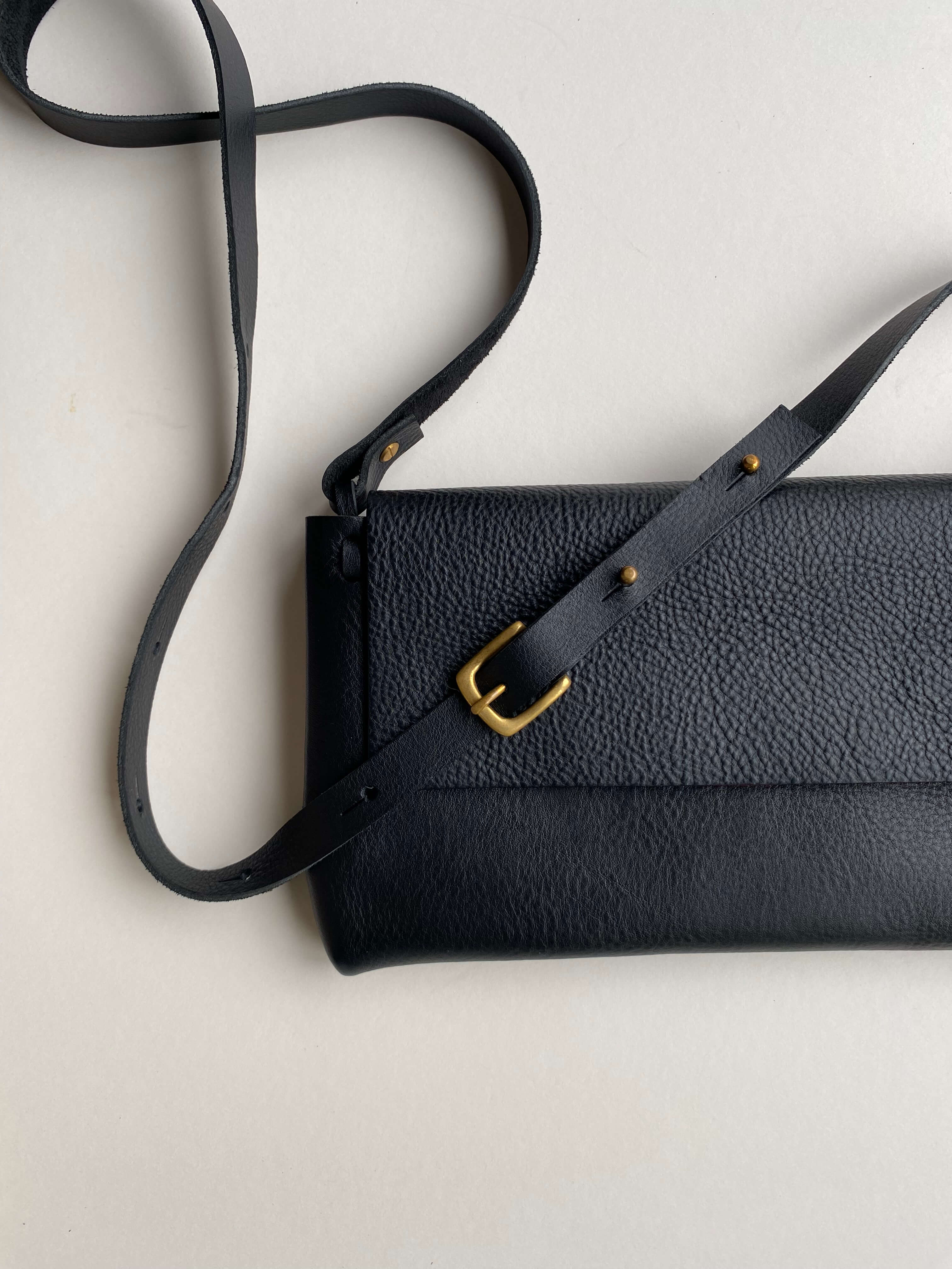 CARV black leather cross body bag minimalist style.