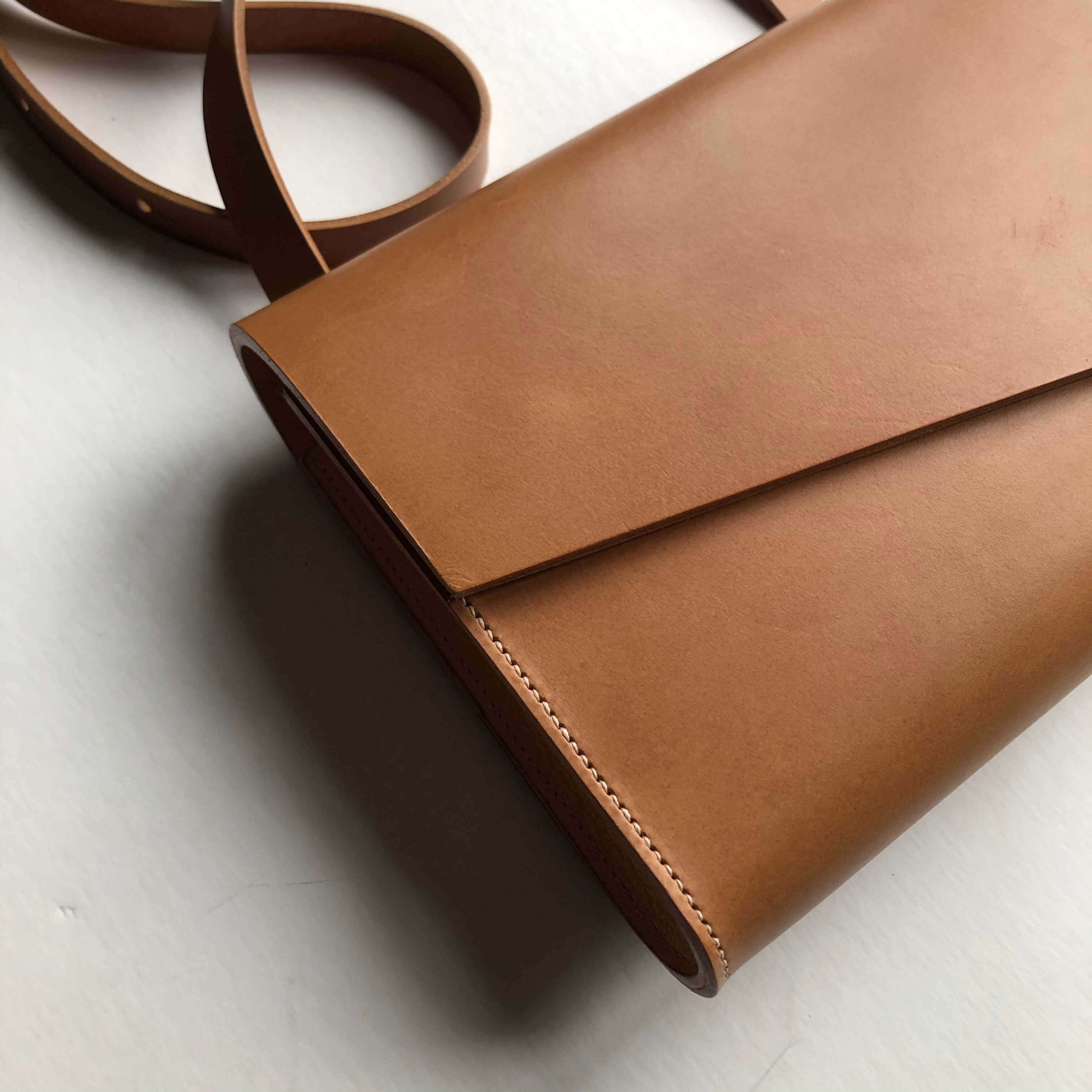 CARV leather cross body bag in tan