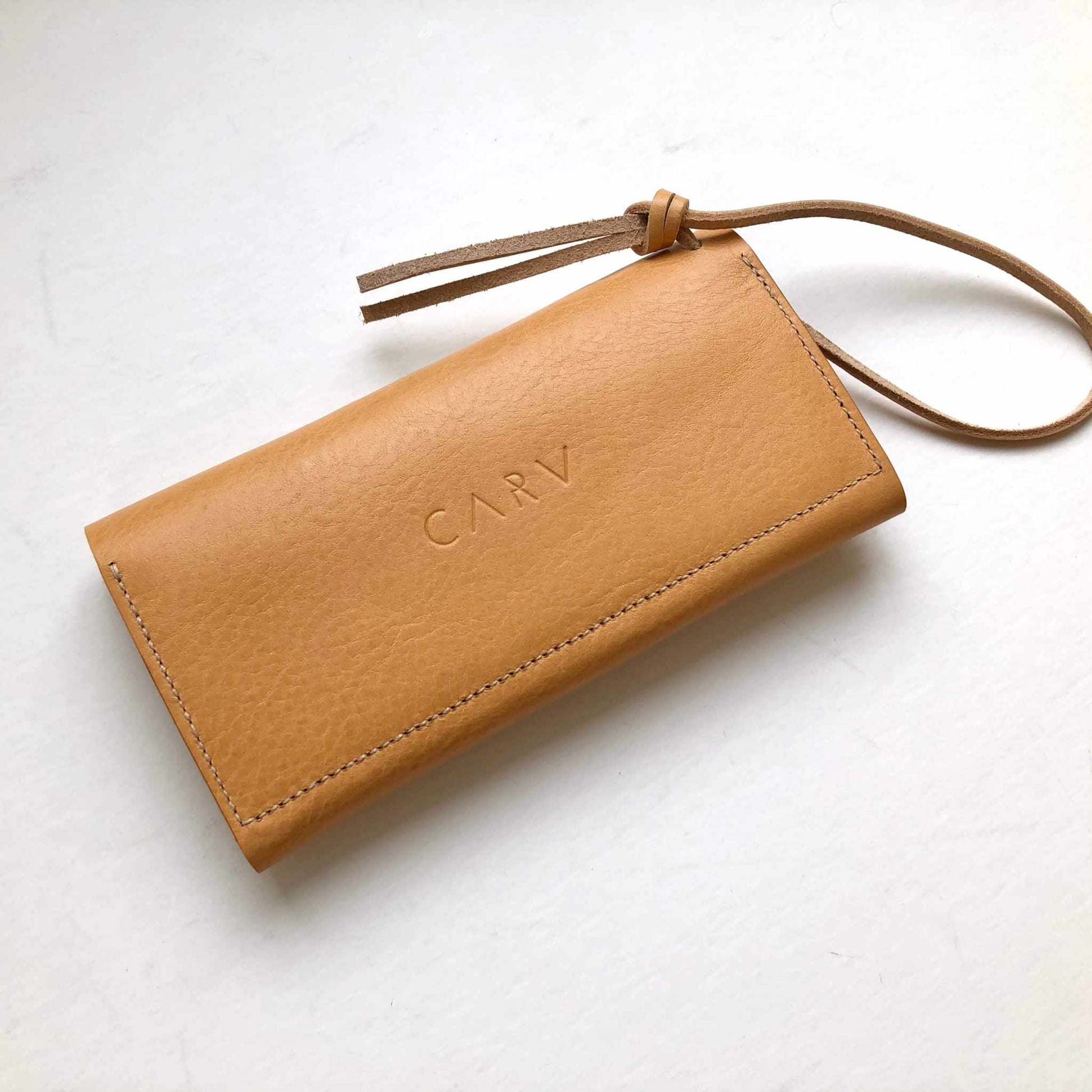 Tan Knot Leather Purse Wallet by CARV with optional wrist strap, handcrafted from vegetable-tanned leather.