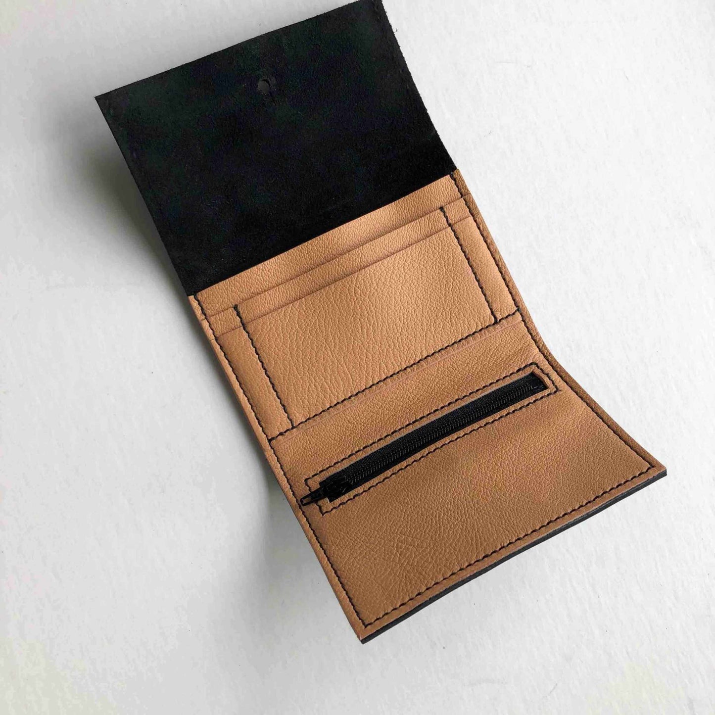 Nomad Mini Handmade Leather Wallet in black, tan, or nude with card slots and zip pocket.