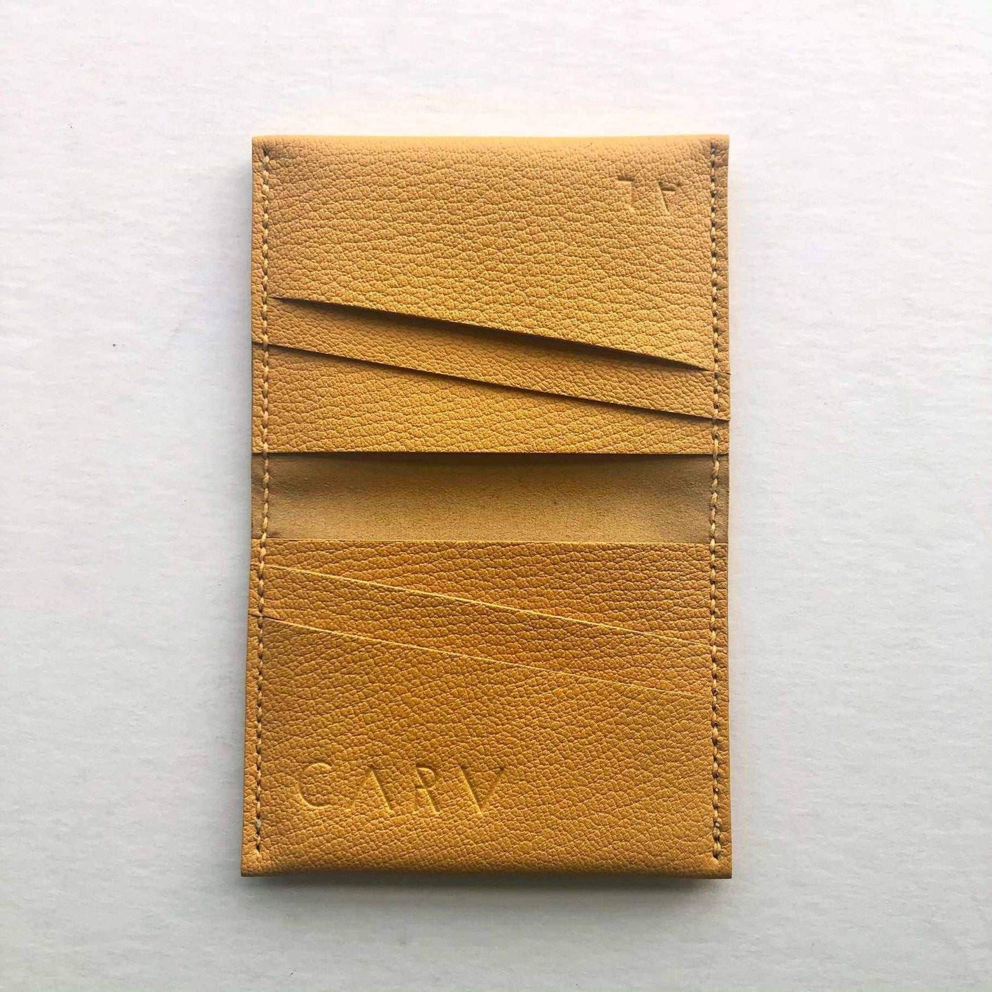 Mustard yellow leather bifold card wallet by CARV, minimalist design, sustainable vegetable-tanned leather.