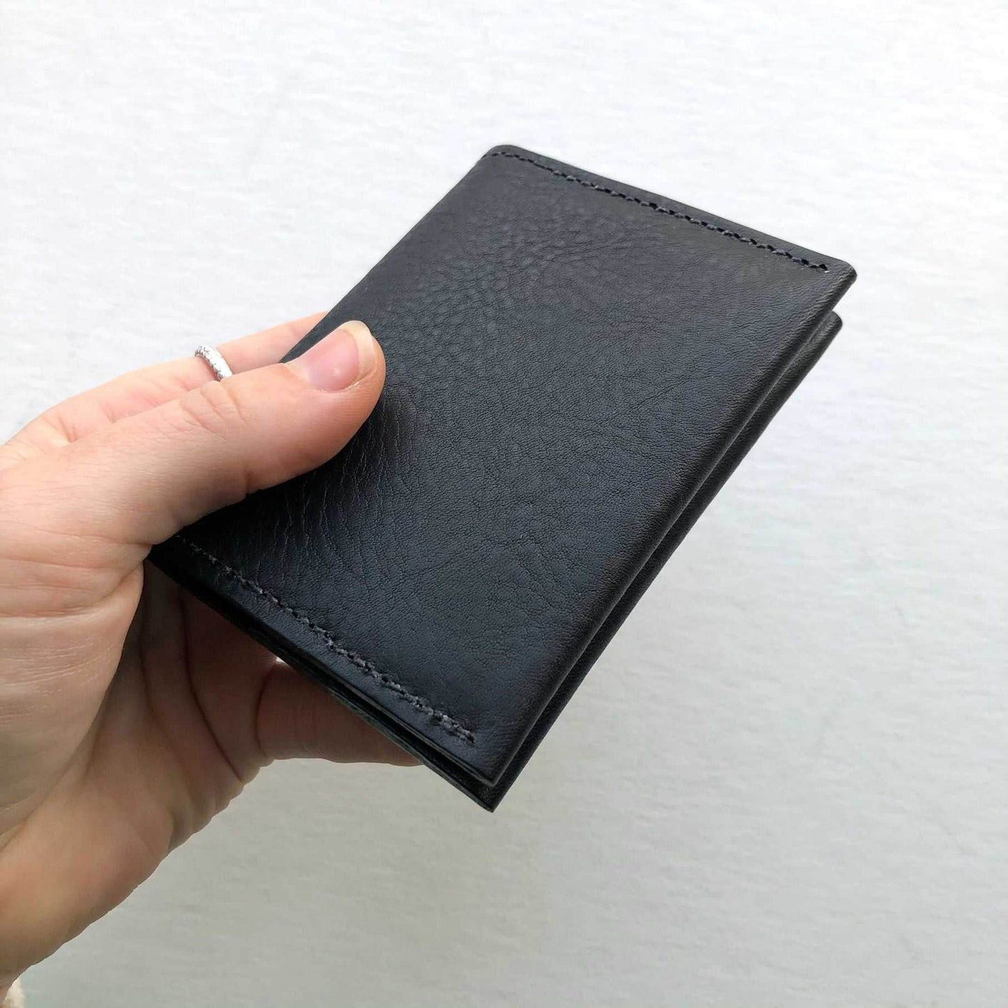 Black Fold Leather Bifold Card Wallet, minimalist design, handcrafted in sustainable leather.