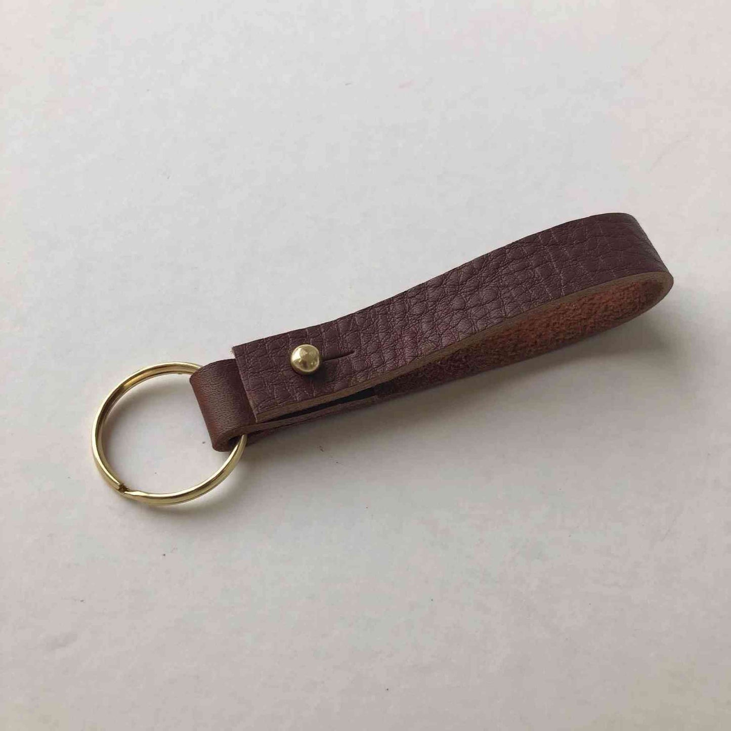 Personalised Leather Keyring in brown with brass closure, artisanal UK-made.