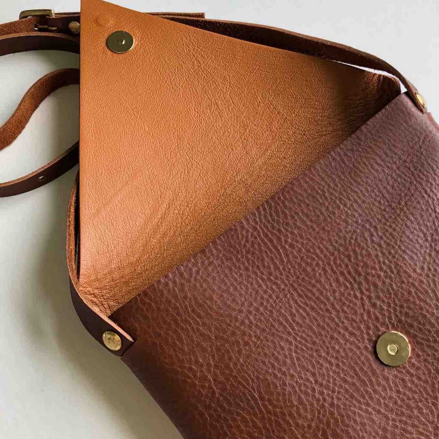 Drifter Leather Crossbody Bag in Tan, handcrafted sustainable full grain leather with brass buckle and press stud closure.