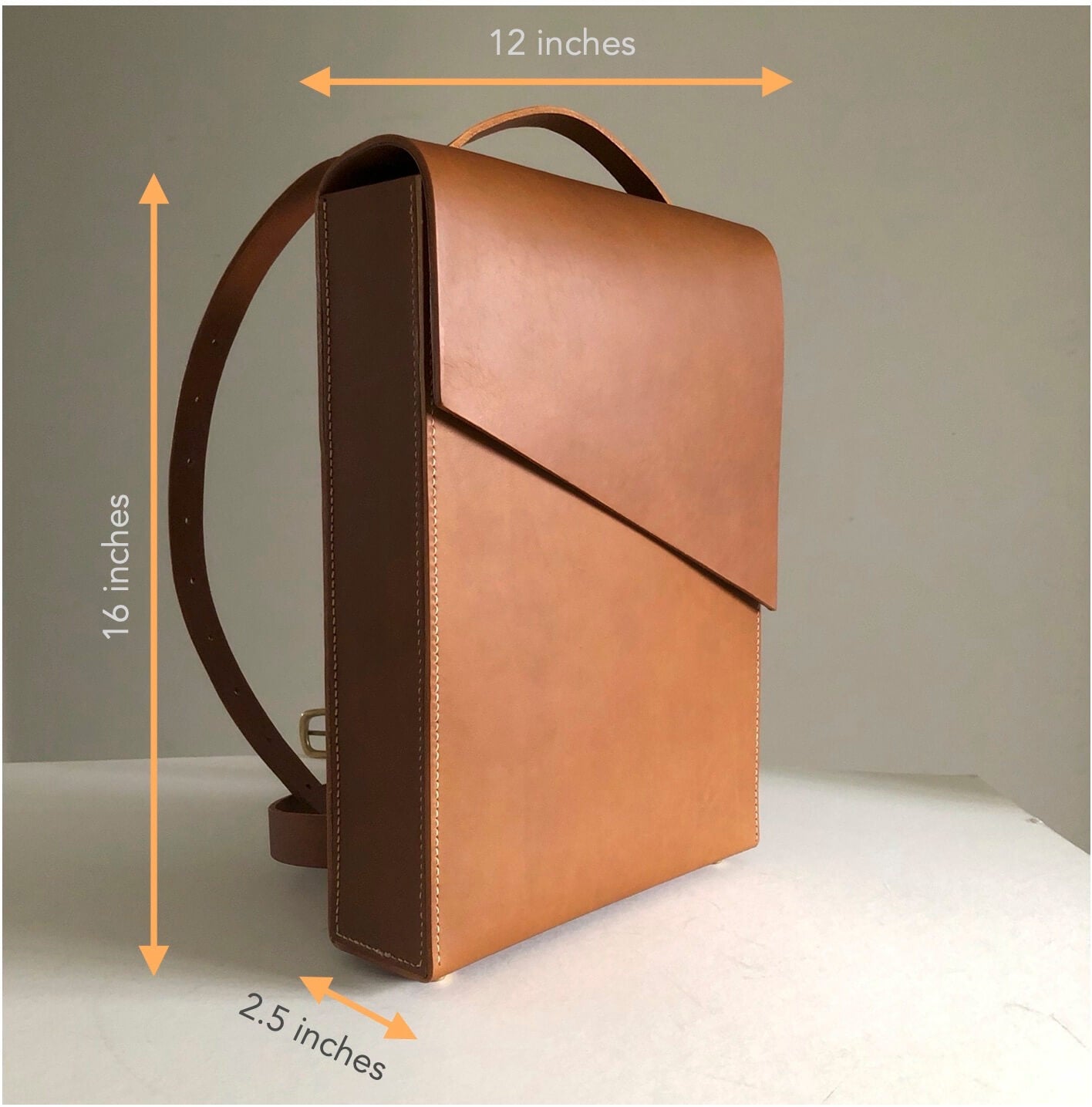 Dimensions of the CARV leather laptop backpack in tan