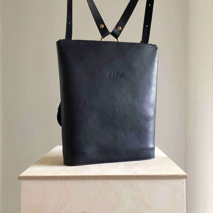 Vita Black Leather Backpack by CARV on display, showcasing its minimalist design and premium craftsmanship.