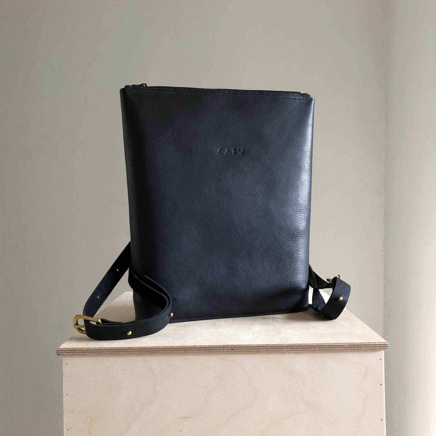 Vita Black Leather Backpack by CARV, minimalist design, premium leather, adjustable straps, handcrafted, sophisticated style.