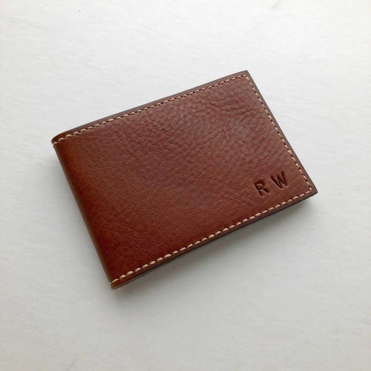 Compact Nomad Leather Bifold Card Wallet in brown, featuring custom embossed initials.