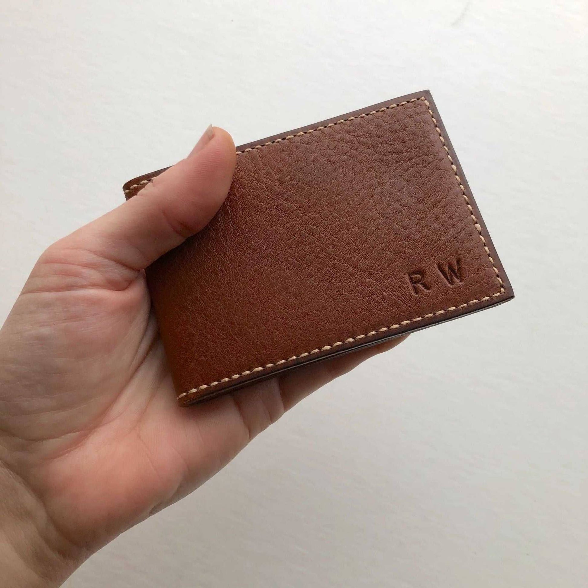 Handcrafted Nomad Leather Bifold Card Wallet in brown, showcasing minimalist design and personalization with initials.