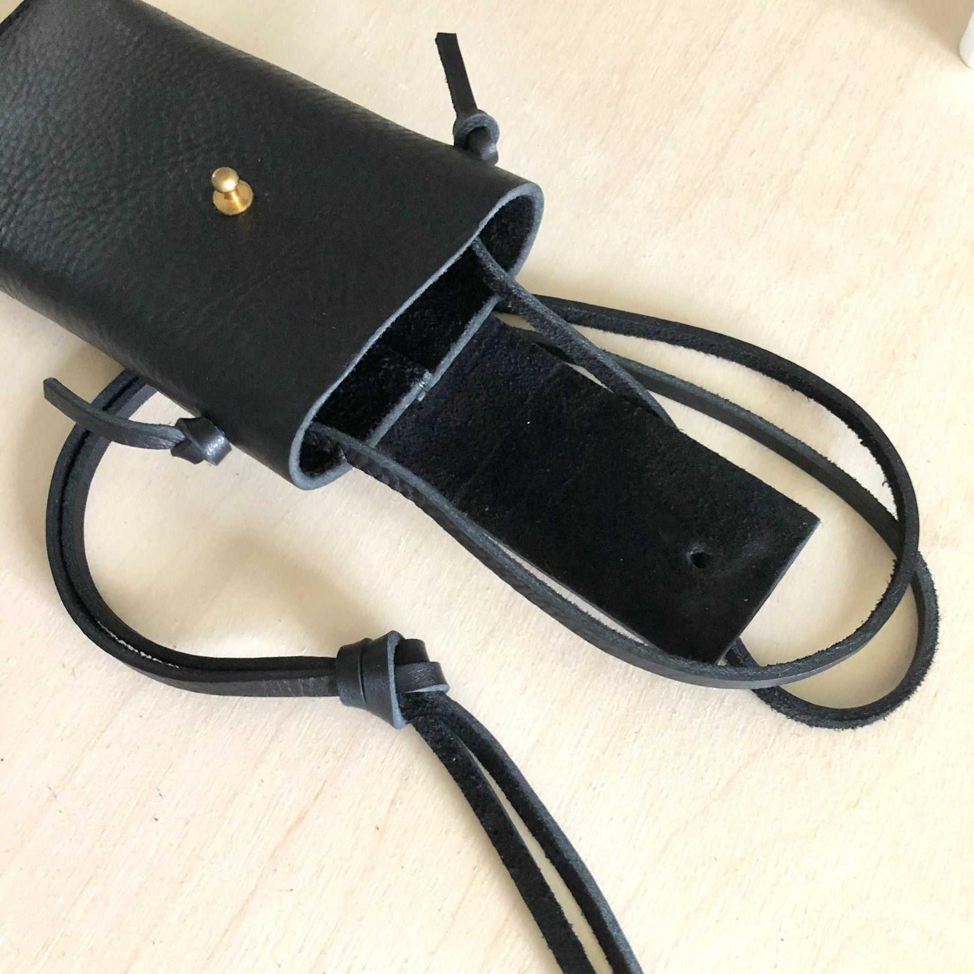 Knot Leather Crossbody Phone Bag in black with adjustable strap and solid brass press stud.