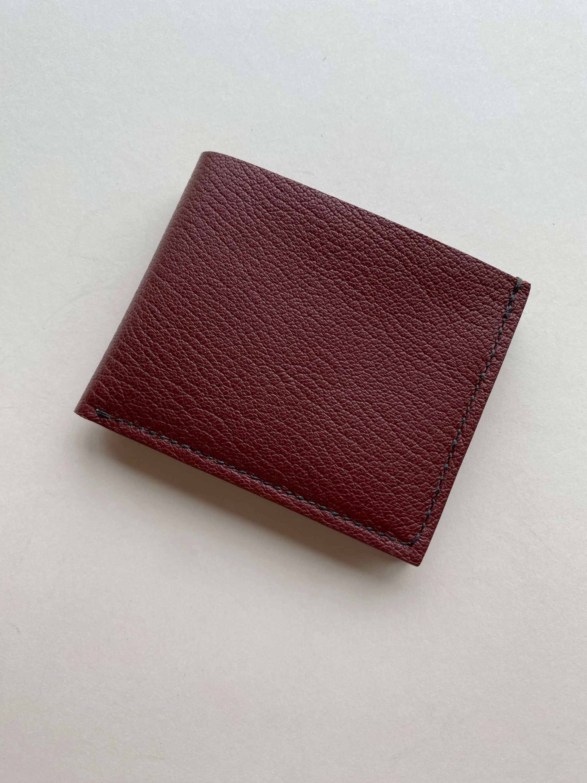 Burgundy Handmade Leather Wallet, minimalist bifold, crafted in the UK.