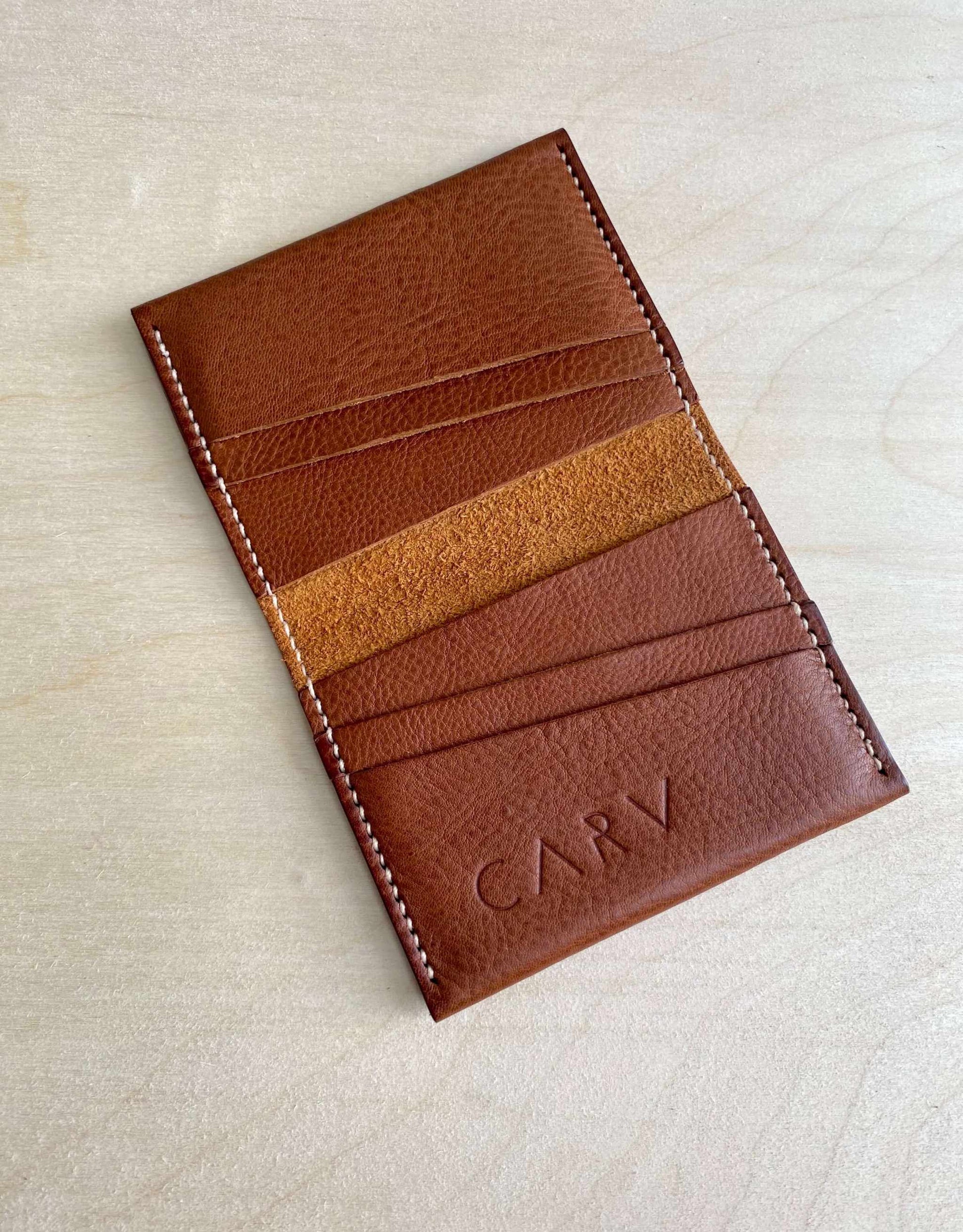 Fold Leather Bifold Card Wallet in Tan by CARV with minimalist design featuring multiple card slots.