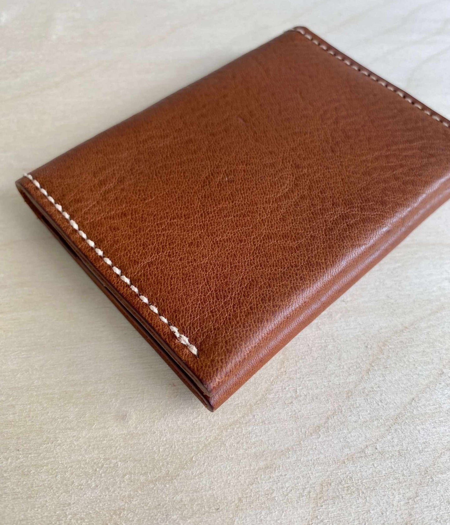 Fold Leather Bifold Card Wallet in tan, minimalist design, handcrafted in sustainable leather.