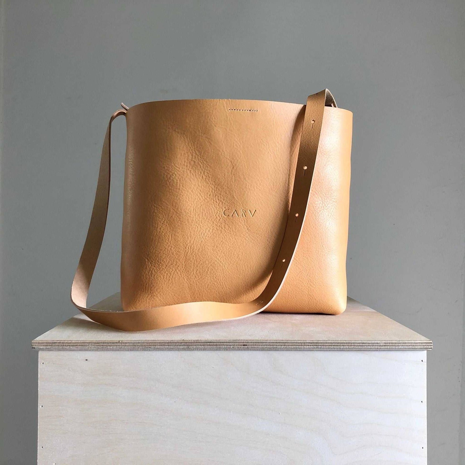 Basket Midi Leather Tote Bag in natural vegetable-tanned leather with adjustable strap, handmade in the UK by CARV.