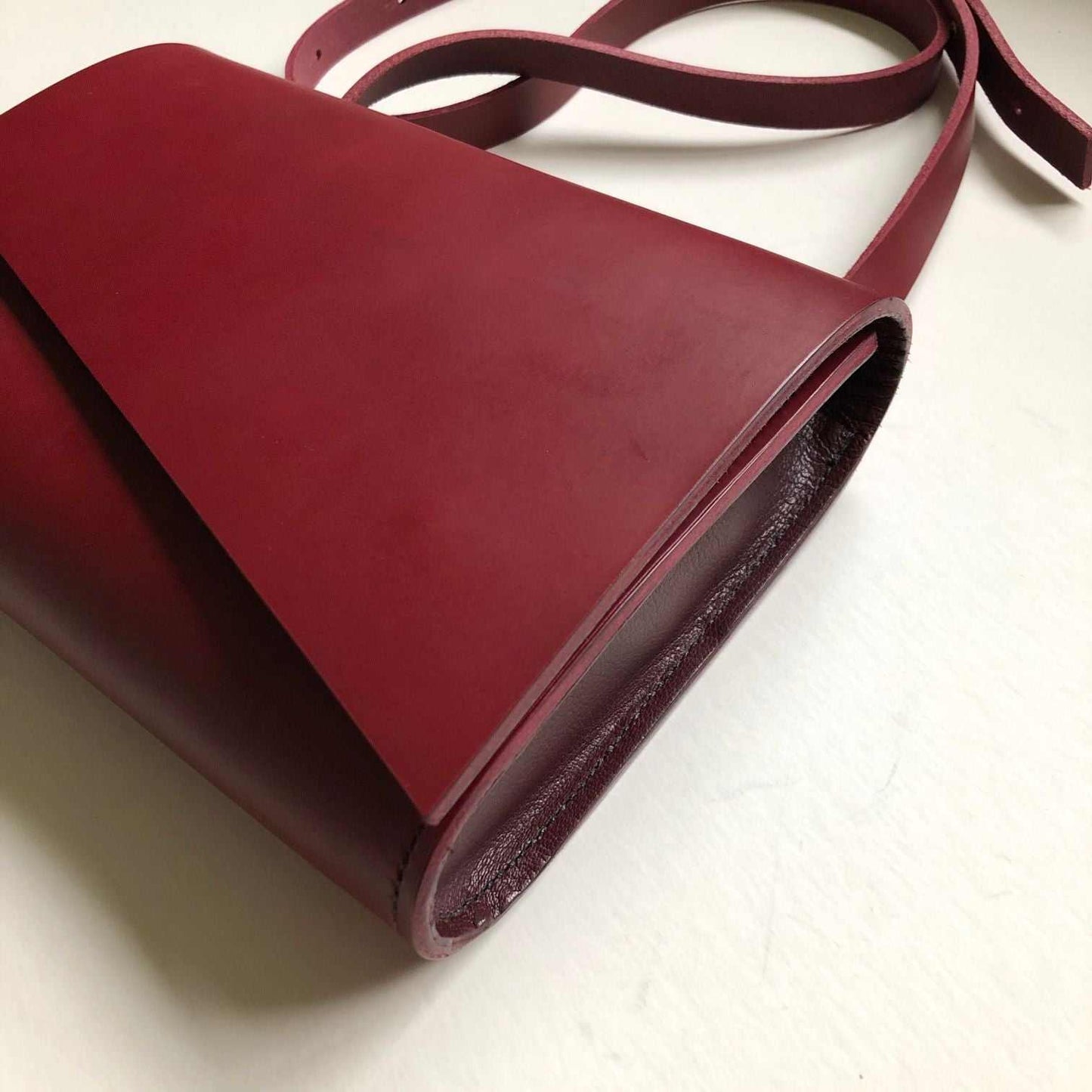 Pioneer Midi Red Leather Crossbody Bag by CARV with adjustable strap and asymmetrical flap design.